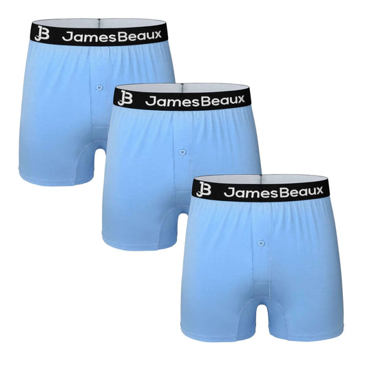 Three pairs of James Beaux men's heather blue bamboo boxer shorts arranged on a white background.